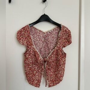 Reformation red floral blouse with tie front closure